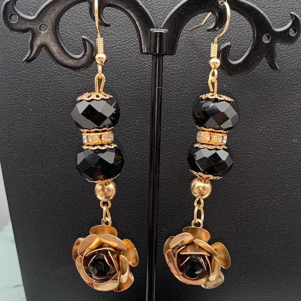 Black and gold tone rose earrings with black faceted beads